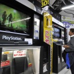 A customer watches a monitor of Sony's v