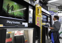 A customer watches a monitor of Sony's v