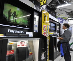 A customer watches a monitor of Sony's v