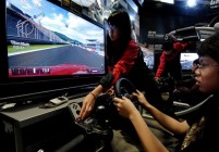 A video game fan tries a driving simulat