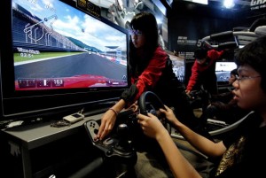 A video game fan tries a driving simulat