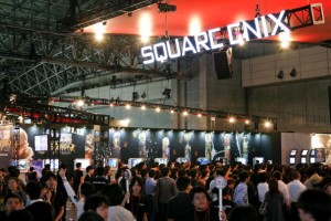 Visitors look at Square Enix Co.'s video game titles display