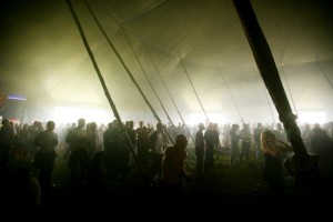 Crowd in a tent. Gloabal Gathering festival 2005, Long Marston Airfield, Stratford Upon Avon. UK. July 2005